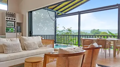 a living room with a couch and a table at Serene Hills in Fortuna