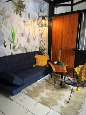 a living room with a couch and a table at Designer-Inspired 1Bed1Bath Condo Close to Beach in Coco