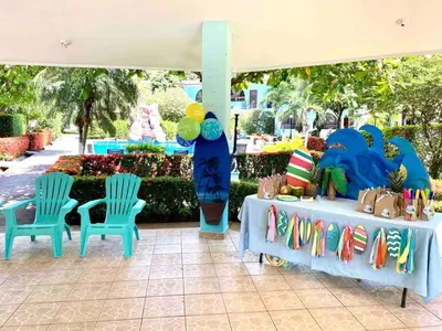 a table with two chairs and a table with a blue table at Casa Verde 2b2b Completely Renovated Ground Unit in Coco