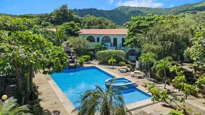 an aerial view of a swimming pool in a yard at Casa Verde 2b2b Completely Renovated Ground Unit in Coco