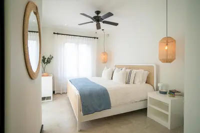 a bedroom with a bed and a ceiling fan at Calle La Ronda 18 At Las Catalinas in Playa Danta