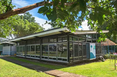 a building with glass doors in a park at Hotel del Sur in San Isidro