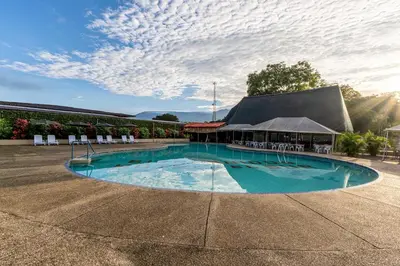 a large swimming pool in front of a building at Hotel del Sur in San Isidro