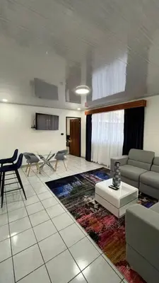 a living room with a couch and a table at Hotel del Sur in San Isidro