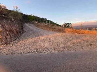 a dirt road on the side of a hill at Cabina vista al valle Monteverde in Monteverde Costa Rica