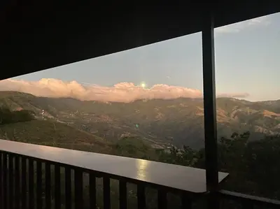 a view of a mountain view from a balcony at Cabina vista al valle Monteverde in Monteverde Costa Rica