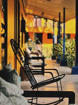 a couple of chairs sitting on a porch at Gran Gavilán del Sarapiquí Lodge in Sarapiquí