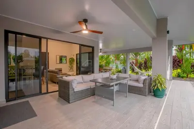 a living room with couches and a ceiling fan at Villa Margarita - Families Getaway in La Fortuna in Fortuna