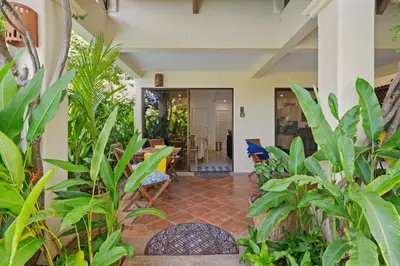 a hallway with plants in a house at Sunshine Escape with a Rooftop Patio in Coco