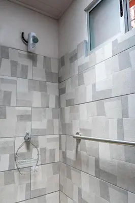 a bathroom with a shower with a glass door at Villa Paz in San José