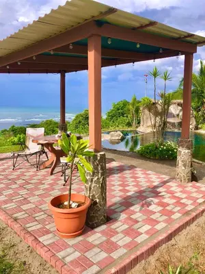a pavilion with a table and a potted plant at Casa Vista Pacifico in Esterillos
