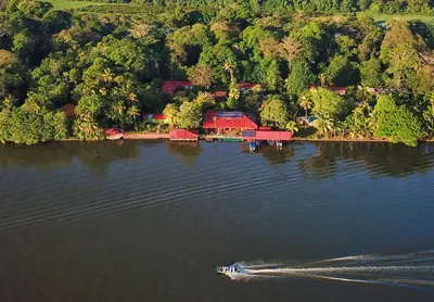 an aerial view of a boat on a lake at Valverde Glamping & Ecolodge in Tortuguero