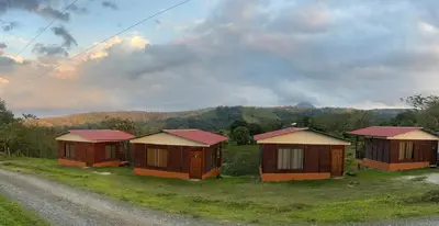 a group of cottages on the side of a road at Cabañas venado 2 in Venado