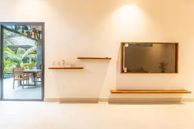 a large flat screen tv on a wall in a room at Coco Nosara Villas Guiones Family Resort Casa José in Nicoya