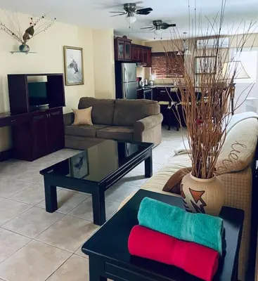 a living room with a couch and a table at Casa de Romá in Coco