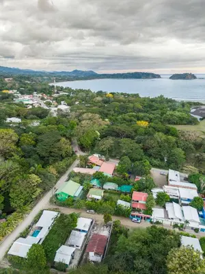 an aerial view of a town with a body of water at Argdivan Beach Hostel in Sámara