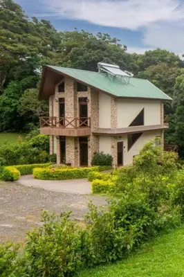 a house with a green roof on top of it at Cabañas Refugio Verde Monteverde in Monteverde Costa Rica