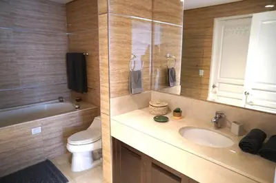a bathroom with a sink and a toilet and a mirror at Comfort and style in San José