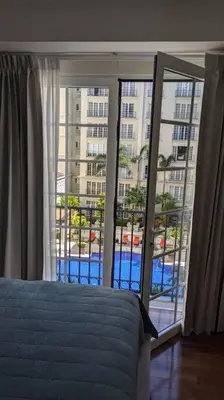 a bedroom with a bed and a large window at Comfort and style in San José
