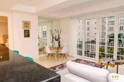a living room with a white couch and a table at Comfort and style in San José
