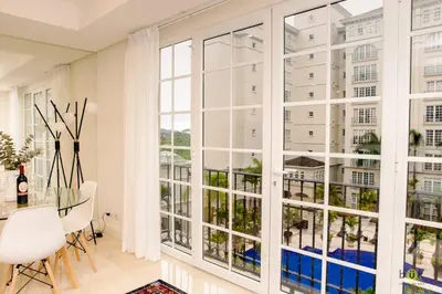 a large window in a room with a table and chairs at Comfort and style in San José