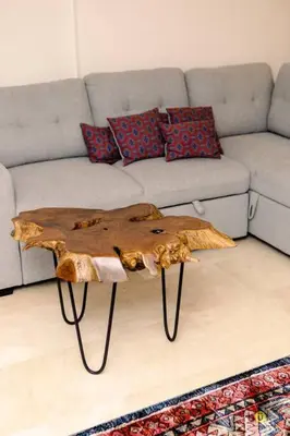 a living room with a couch and a wooden coffee table at Comfort and style in San José
