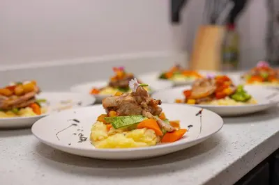 a row of plates of food on a counter at Villa Graceland - Arenal Volcano View in Fortuna
