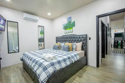 a bedroom with a large bed in a room at Villa Graceland - Arenal Volcano View in Fortuna