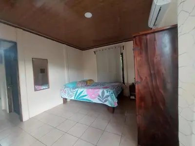a small bedroom with a bed in a room at White Passiflora - Private Jacuzzi in Fortuna
