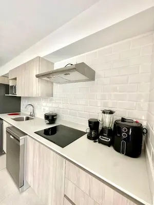 a kitchen with a sink and a counter top at Viva in Jacó