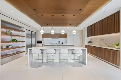 a kitchen with a large island with bar stools at Luxurious Villa in Papagayo in Nacascolo
