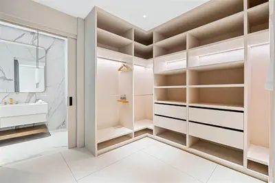 a walk in closet with white cabinets and a sink at Luxurious Villa in Papagayo in Nacascolo