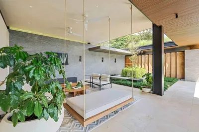 a living room with a couch and a potted plant at Luxurious Villa in Papagayo in Nacascolo