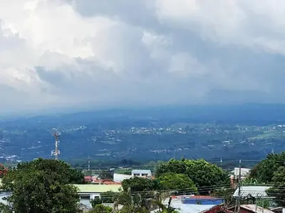 a view of a city from a hill at Mountain View Estudio in Cinco Esquinas