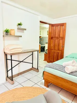a bedroom with a bed and a desk at Sweet Home Carrion 2 y 3 in Fortuna
