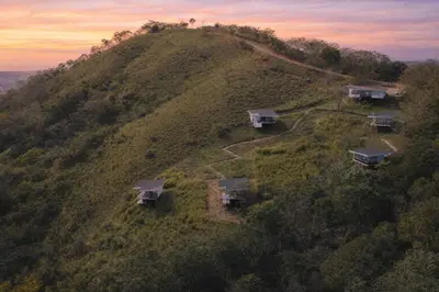 an aerial view of a house on a hill at Nosara Hideaway 2 - BREAKFAST PROVIDED & Mountain View Cabins in Nicoya