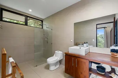 a bathroom with a toilet and a sink and a shower at Stunning Villa with 3 Bedrooms Pool in Coco