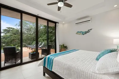 a bedroom with a bed and a balcony at Stunning Villa with 3 Bedrooms Pool in Coco