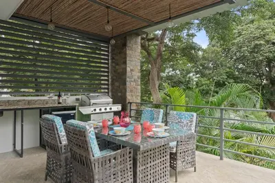 a patio with a table and chairs and a grill at Stunning Villa with 3 Bedrooms Pool in Coco