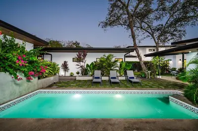 a swimming pool in the backyard of a house at Villa Serenity 2 Bedroom 1 min walk to the beach in Santa Cruz