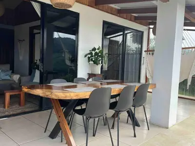 a wooden table and chairs in a room at Alas House, Monteverde with amazing sunset view! in Monteverde Costa Rica