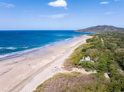 an aerial view of a beach and the ocean at Villa Serenity 4 bedroom 1 min walk to the beach in Santa Cruz