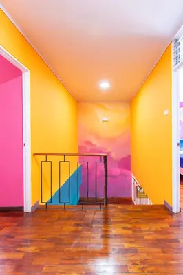 a room with a colorful wall with a table in it at Casa Zafiro B&B in San José
