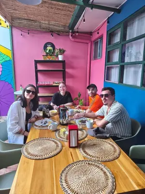 a group of people sitting around a table at Casa Zafiro B&B in San José