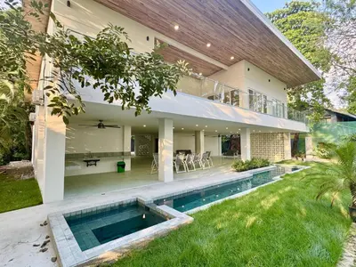 an exterior view of a house with a swimming pool at Esterillos Lote home in Esterillos