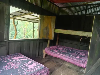 an inside view of a room with two beds at Cabañas con camping con tiendas de campaña Isla brava in Colorado