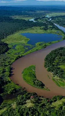 an aerial view of a river and land with water at Cabañas con camping con tiendas de campaña Isla brava in Colorado