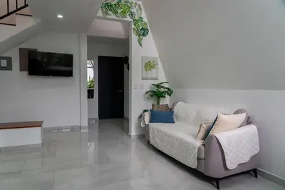 a living room with a couch and a tv at Gival Paradise in Fortuna