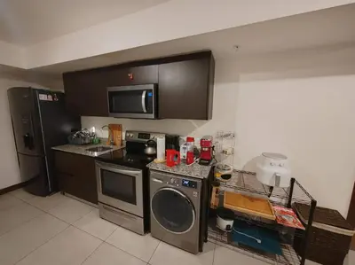 a kitchen with a stove and a dishwasher at Elegante apartamento en ciudad in San José