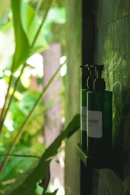 a bottle ofmooc on the side of a wall at Bamboo River Lodge in Horquetas